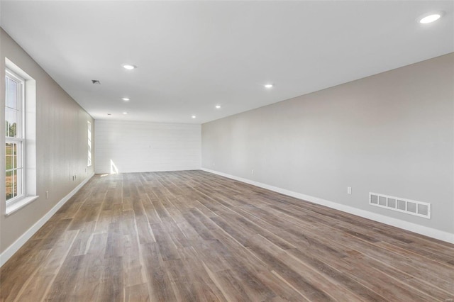 unfurnished room with hardwood / wood-style floors