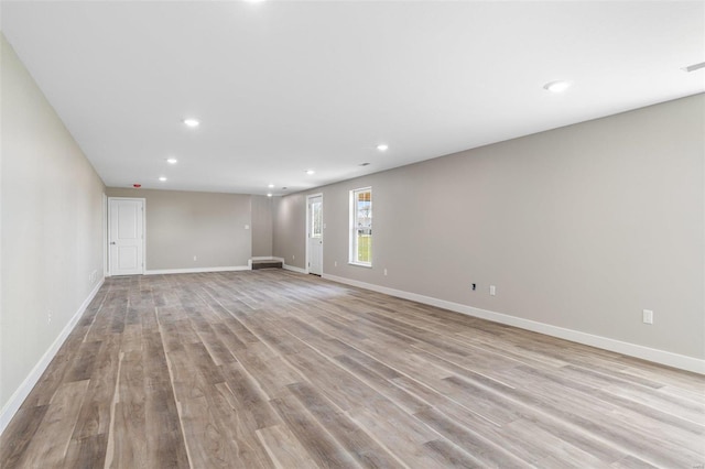 spare room featuring light wood-type flooring