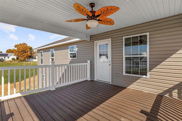 deck featuring a lawn and ceiling fan