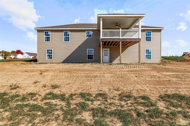 back of property featuring ceiling fan