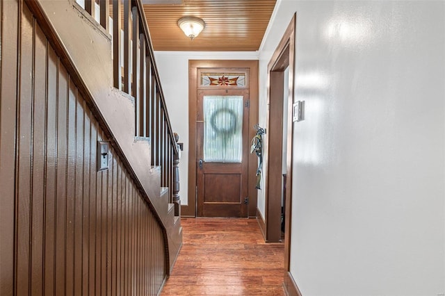 doorway to outside with wooden ceiling and dark hardwood / wood-style flooring