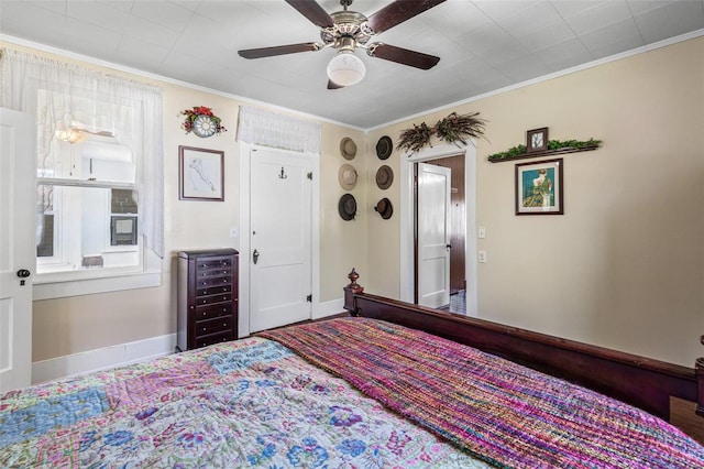 bedroom featuring ceiling fan and crown molding