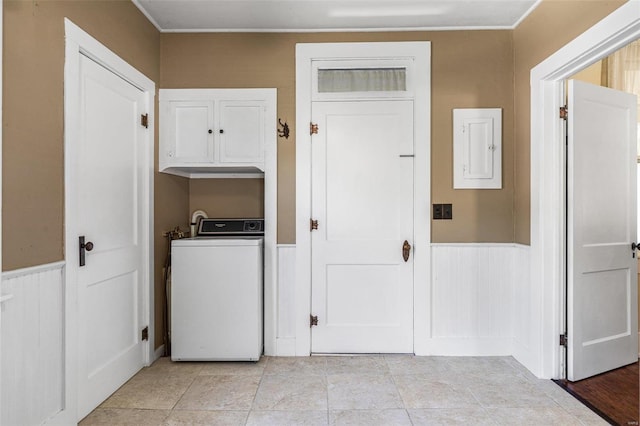 laundry area with washer / dryer, electric panel, and light tile patterned floors