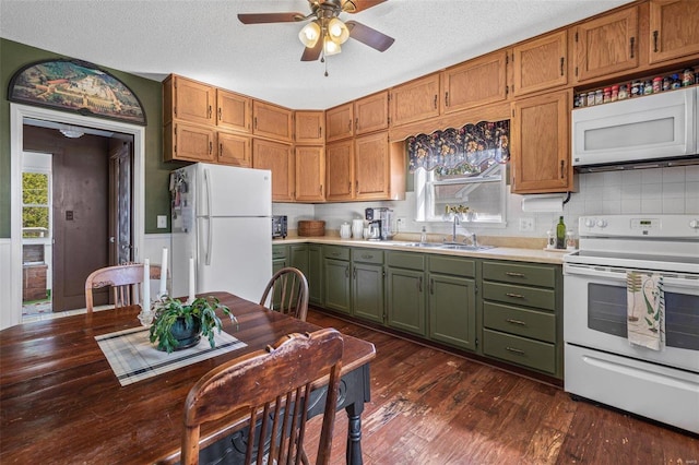 kitchen with decorative backsplash, sink, a textured ceiling, white appliances, and dark hardwood / wood-style flooring