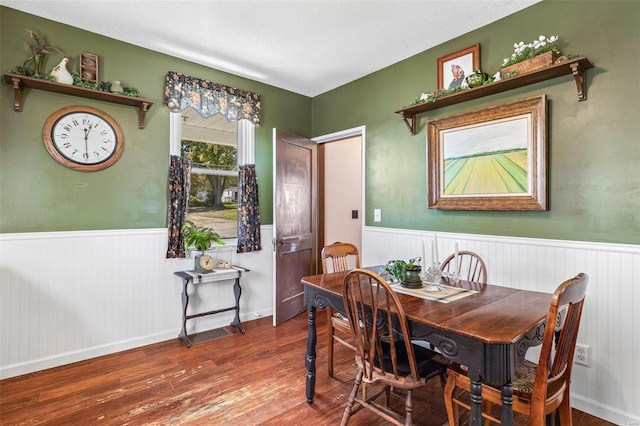 dining area with hardwood / wood-style floors