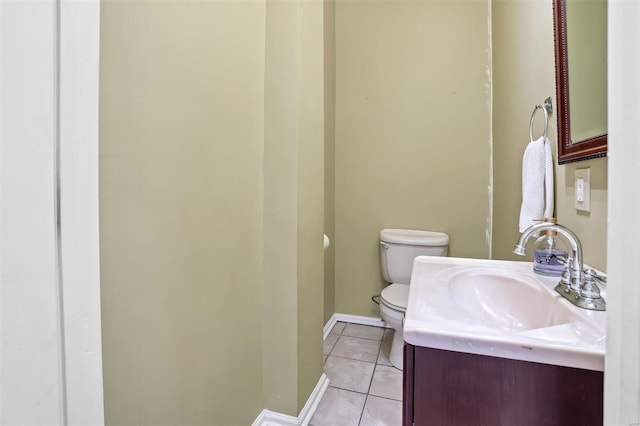 bathroom featuring vanity, toilet, and tile patterned flooring