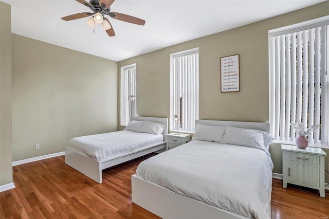 bedroom featuring ceiling fan and wood-type flooring