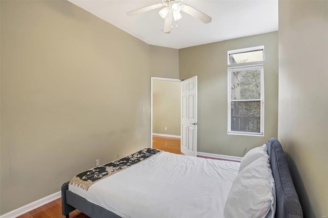 bedroom featuring ceiling fan and hardwood / wood-style flooring