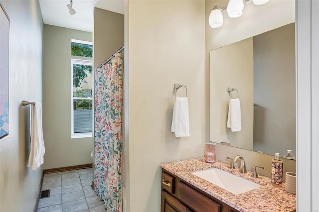 bathroom with vanity and tile patterned flooring