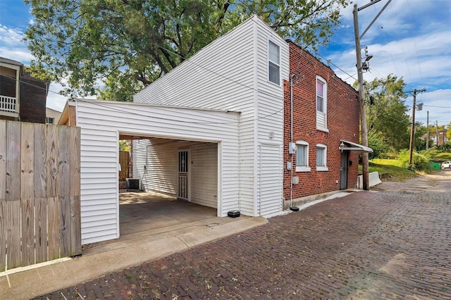 view of home's exterior featuring a carport