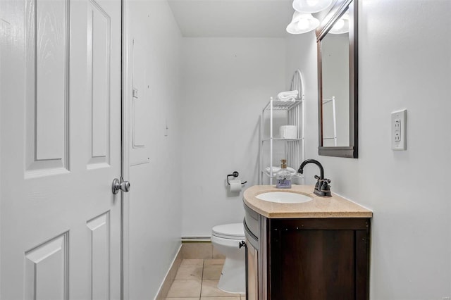 bathroom with vanity, toilet, and tile patterned flooring