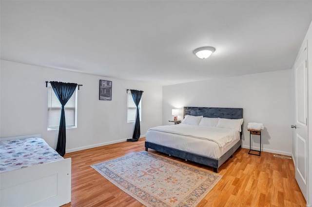 bedroom featuring light wood-type flooring