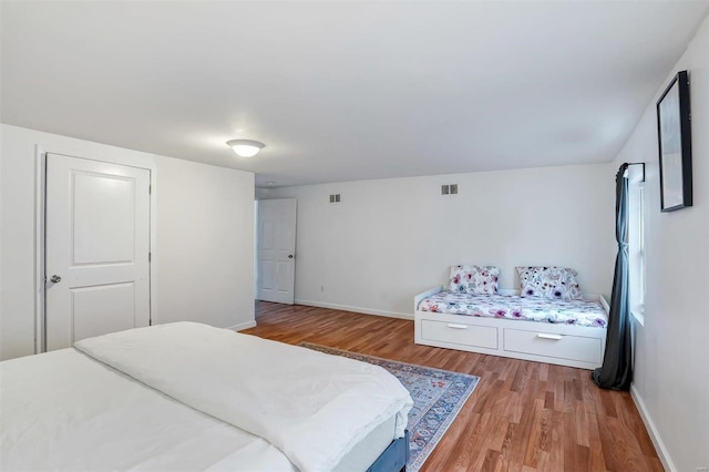 bedroom featuring hardwood / wood-style floors