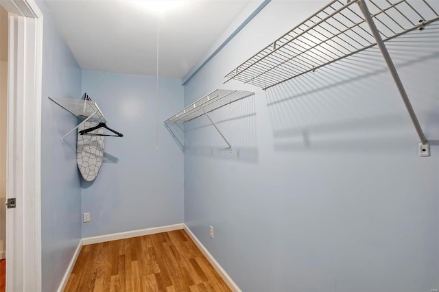 walk in closet featuring hardwood / wood-style floors