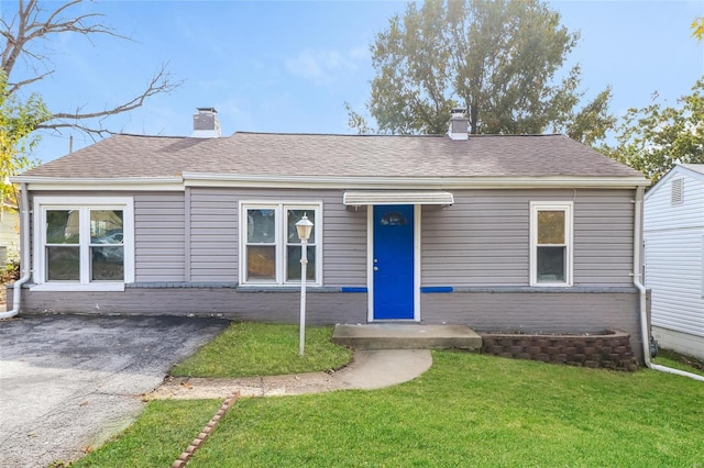 ranch-style house with a front yard