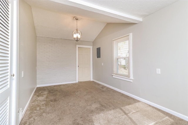 carpeted empty room featuring an inviting chandelier, lofted ceiling, and a textured ceiling