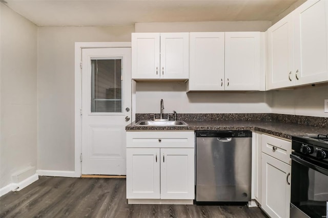 kitchen featuring dark hardwood / wood-style floors, dark stone counters, sink, stainless steel dishwasher, and white cabinetry