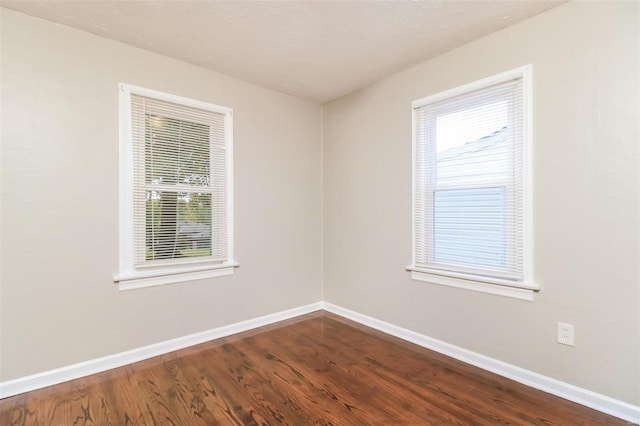 spare room featuring hardwood / wood-style floors