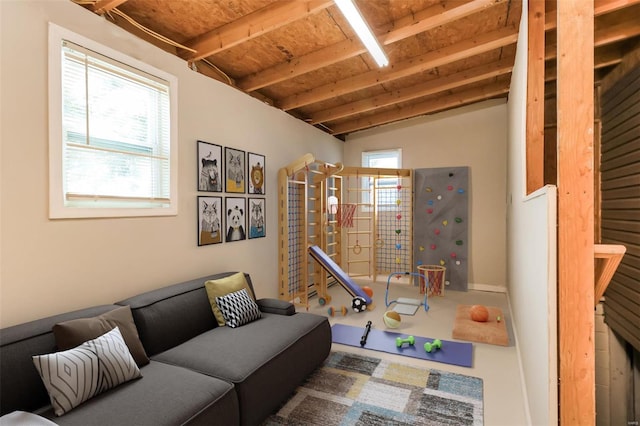 interior space featuring vaulted ceiling with beams