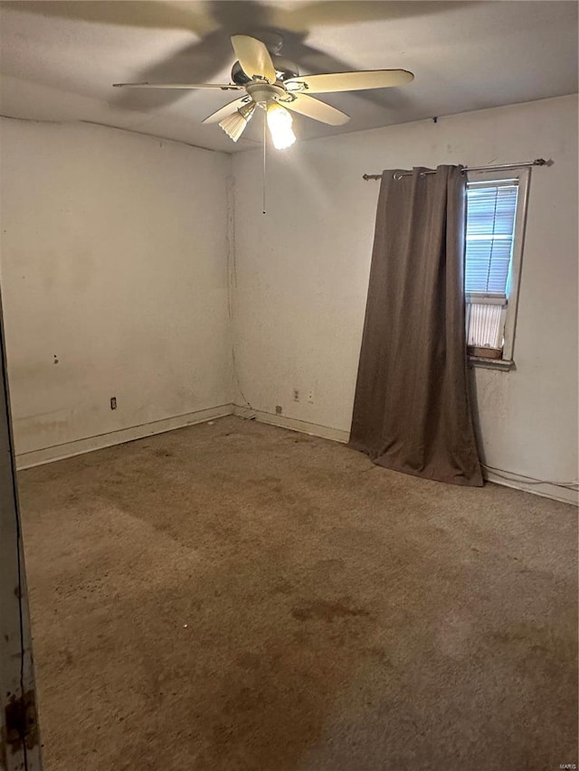 empty room with carpet and ceiling fan