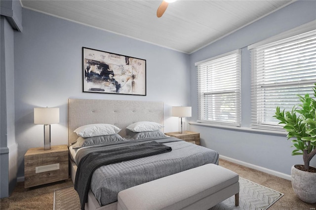 carpeted bedroom with crown molding and ceiling fan