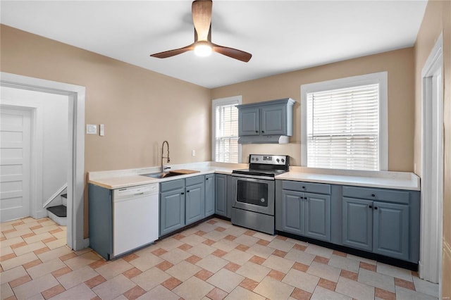 kitchen featuring sink, dishwasher, stainless steel range with electric cooktop, and ceiling fan