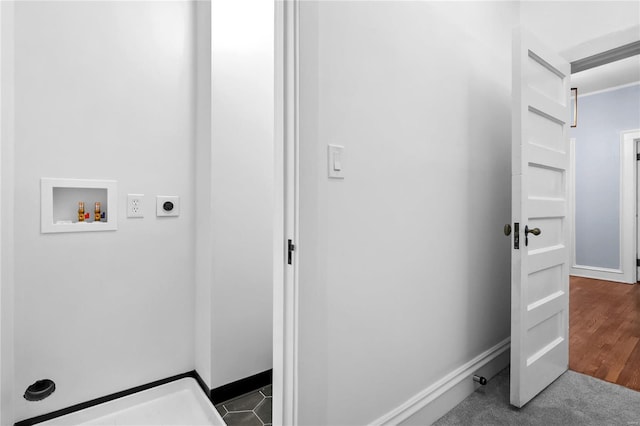 laundry room with hookup for a washing machine, electric dryer hookup, and dark hardwood / wood-style floors