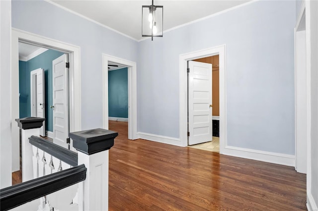 unfurnished room featuring crown molding and wood-type flooring