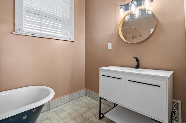 bathroom with vanity, a bathing tub, and tile patterned floors