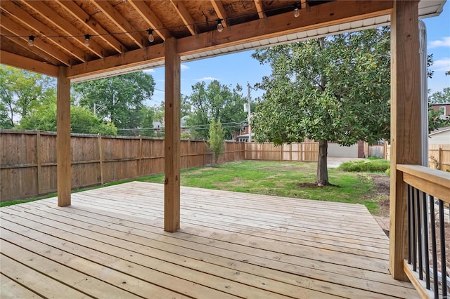 wooden deck with a yard