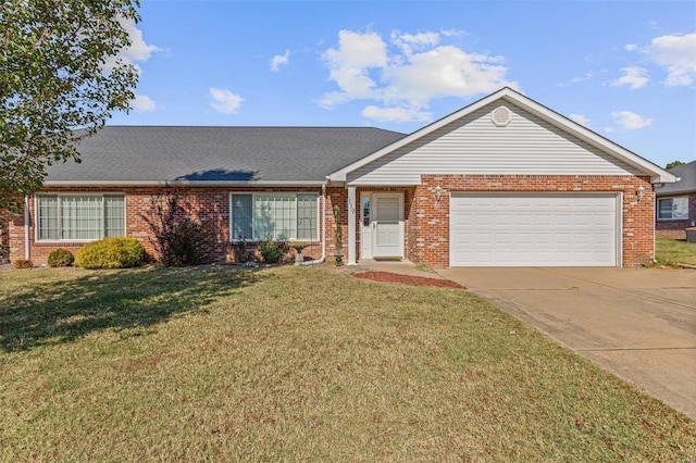 ranch-style house featuring a front yard and a garage