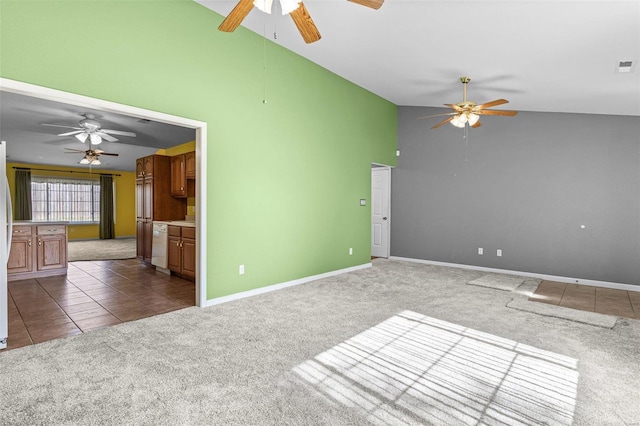 unfurnished living room with dark carpet, high vaulted ceiling, and ceiling fan