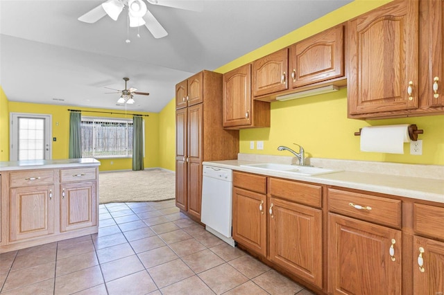 kitchen featuring light tile patterned flooring, sink, dishwasher, ceiling fan, and vaulted ceiling