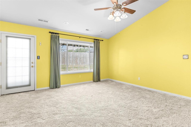 unfurnished room with ceiling fan, carpet, and vaulted ceiling