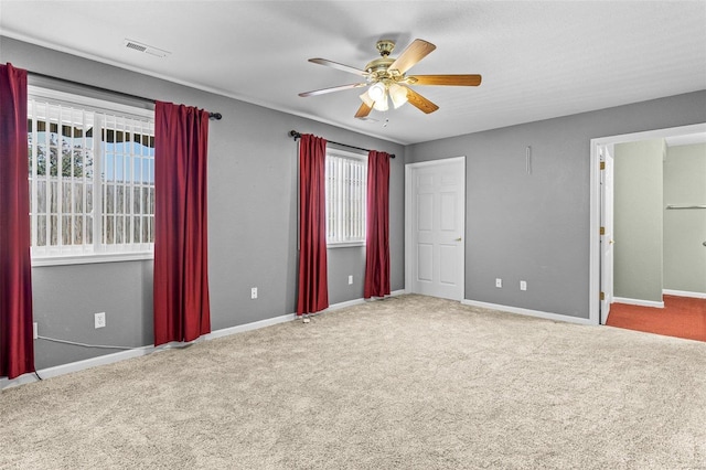 unfurnished bedroom featuring carpet flooring and ceiling fan