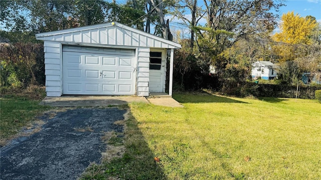 garage with a yard