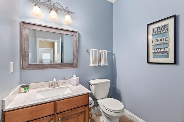 bathroom featuring vanity, toilet, and tile patterned floors