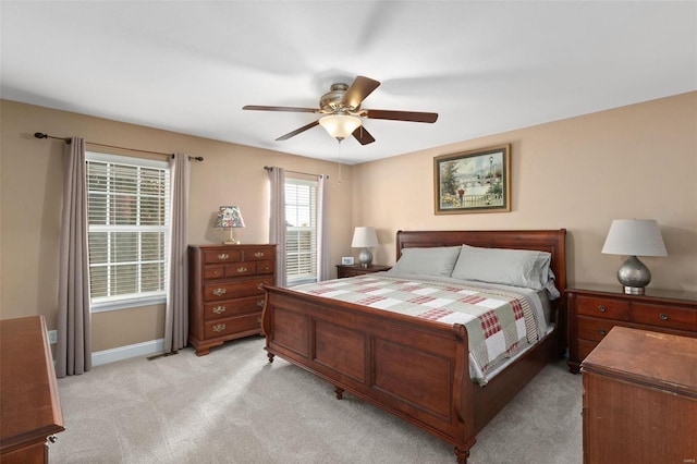 bedroom featuring ceiling fan and light colored carpet