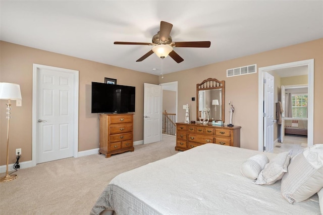 bedroom with ceiling fan and light colored carpet