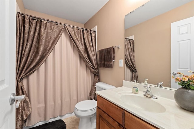 bathroom with vanity, toilet, tile patterned floors, and walk in shower