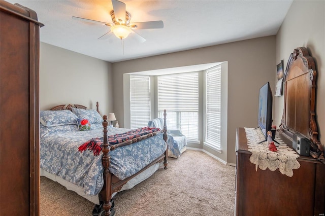 bedroom with light carpet and ceiling fan