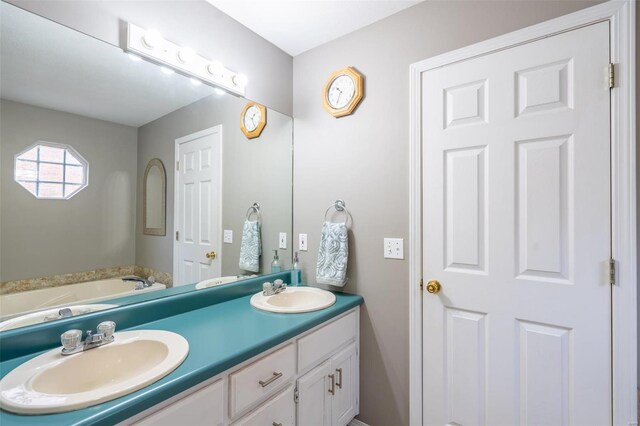 bathroom featuring vanity and a bathing tub