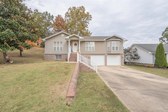 view of front of house with a garage and a front lawn