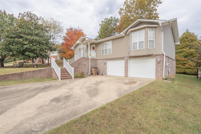 view of front of house featuring a front yard and a garage