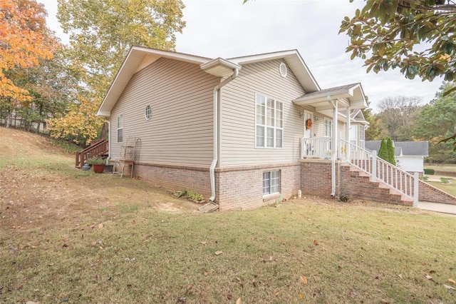 view of home's exterior featuring a lawn