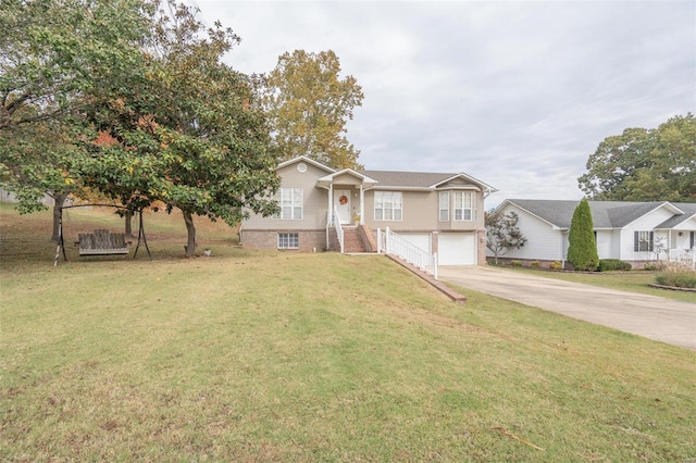 view of front of home with a front yard and a garage