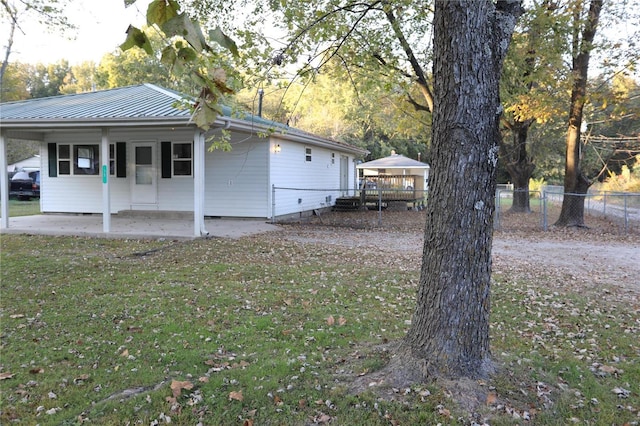 view of home's exterior featuring a patio and a yard