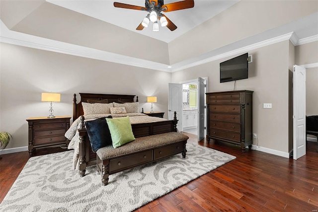 bedroom featuring crown molding, dark hardwood / wood-style floors, connected bathroom, and ceiling fan