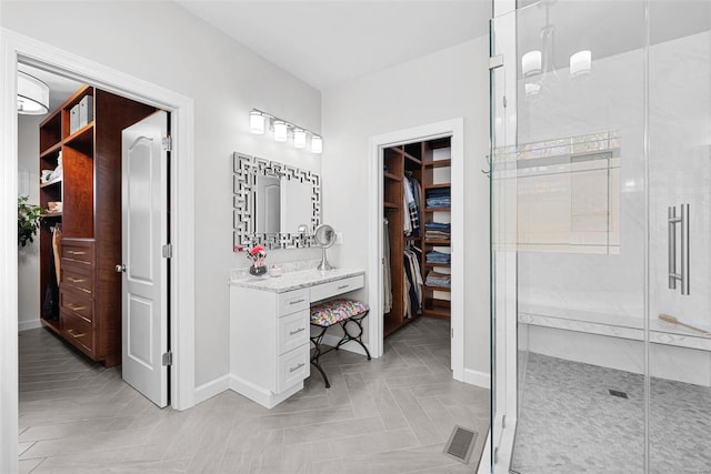 bathroom featuring vanity and walk in shower