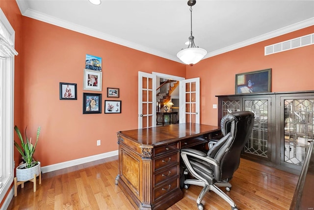 office area featuring light hardwood / wood-style floors and crown molding